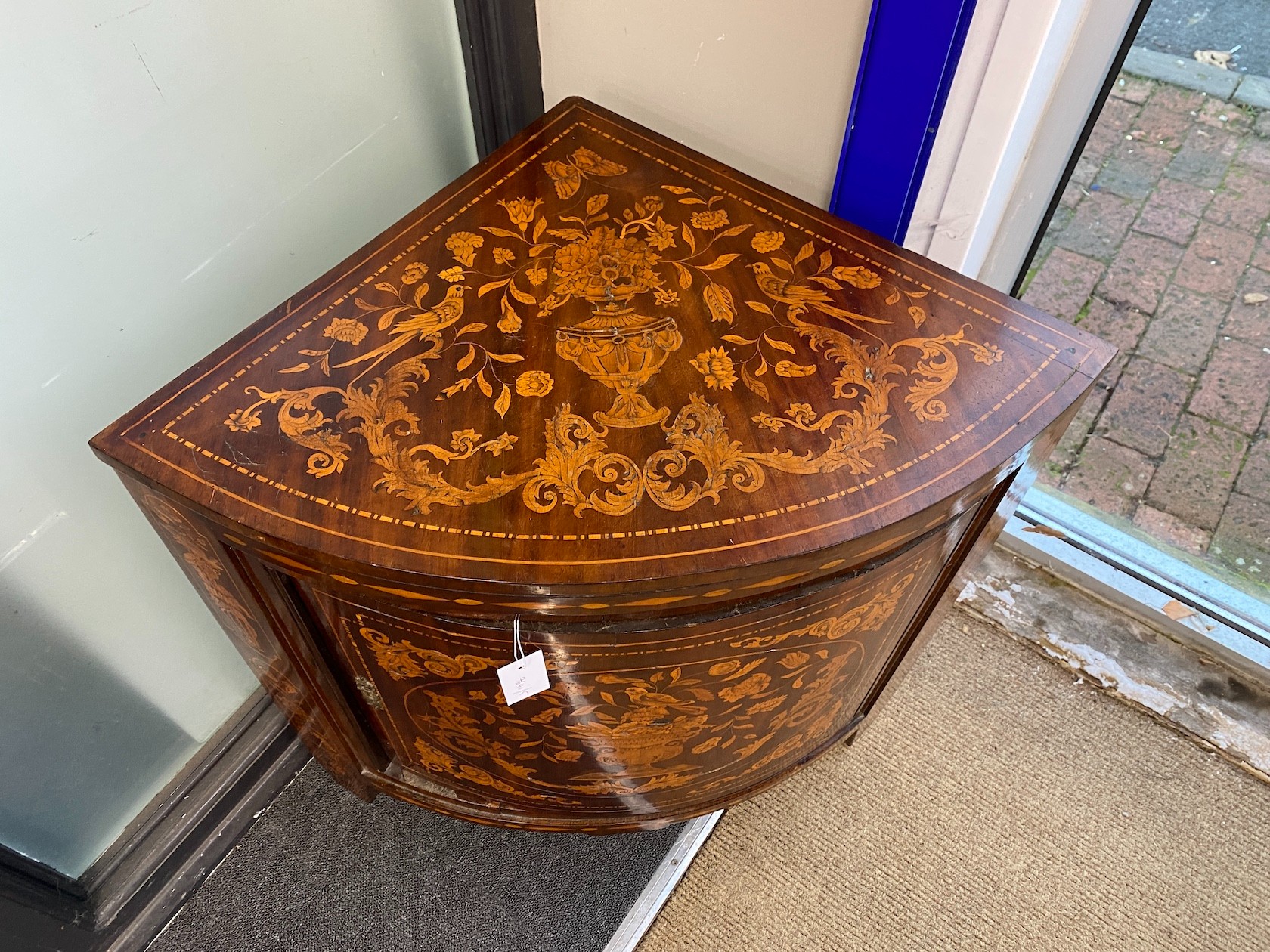 An early 19th century Dutch floral marquetry walnut bow front corner cabinet, width 35cm, depth 52cm, height 73cm